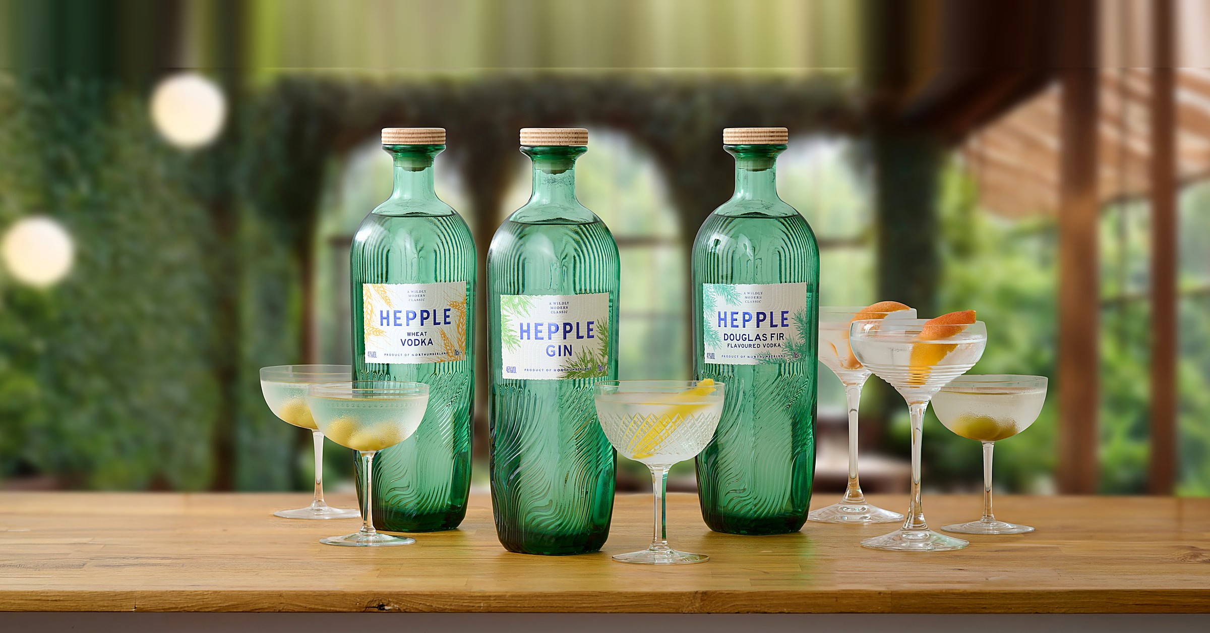 The Hepple range with cocktails in the greenhouse